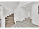 Elegant staircase with carpeted steps and white railing, adjacent to modern gray flooring at 271 Francisco St, Henderson, NV 89014