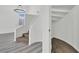 Carpeted staircase with white railing and an ornate chandelier at 271 Francisco St, Henderson, NV 89014