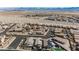 Aerial view of the neighborhood with mountains and desert, showcasing homes with diverse architectural styles at 2721 Benton Cove St, Laughlin, NV 89029