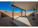 Covered patio with concrete base and gravel surround, provides a versatile and relaxing outdoor area at 2721 Benton Cove St, Laughlin, NV 89029