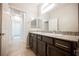 Bathroom featuring granite countertops, dual sinks, and tiled flooring at 2721 Benton Cove St, Laughlin, NV 89029