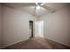 Bedroom features neutral carpet, ceiling fan, and ensuite bathroom at 2721 Benton Cove St, Laughlin, NV 89029