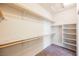 Spacious walk-in closet with ample shelving, carpeted flooring, and room for organization at 2721 Benton Cove St, Laughlin, NV 89029