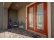 Welcoming front porch featuring double doors, a stone paver walkway, and potted flowers for added curb appeal at 2721 Benton Cove St, Laughlin, NV 89029