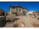 Beautiful single-story home featuring brick accents, desert landscaping, and a two-car garage at 2721 Benton Cove St, Laughlin, NV 89029