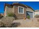 Beautiful single-story home featuring brick accents, desert landscaping, and a two-car garage at 2721 Benton Cove St, Laughlin, NV 89029