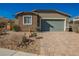 Charming single-story home with a two-car garage and desert landscaping at 2721 Benton Cove St, Laughlin, NV 89029