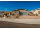 Charming single-story home with a two-car garage and desert landscaping at 2721 Benton Cove St, Laughlin, NV 89029