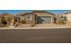 Charming single-story home with a two-car garage and desert landscaping at 2721 Benton Cove St, Laughlin, NV 89029