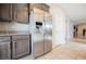 Kitchen features stainless steel refrigerator with water dispenser and granite countertops at 2721 Benton Cove St, Laughlin, NV 89029