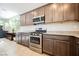 Beautiful kitchen with stainless steel appliances, granite countertops and custom cabinets at 2721 Benton Cove St, Laughlin, NV 89029