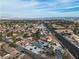 An elevated view of a home and neighborhood with desert landscaping and a well-maintained street at 2749 Horseshoe Dr, Las Vegas, NV 89120