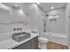 Stylish bathroom with modern vanity, sleek mirror, and combined shower and bathtub at 2749 Horseshoe Dr, Las Vegas, NV 89120