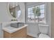 An updated bathroom featuring modern sink, mirror, toilet, and bright window at 2749 Horseshoe Dr, Las Vegas, NV 89120