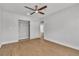 Bedroom features wood-look flooring, ceiling fan, closet with sliding doors, and fresh neutral paint at 2749 Horseshoe Dr, Las Vegas, NV 89120