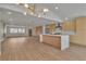 Bright kitchen with stainless steel appliances, a center island with seating, and modern light fixture at 2749 Horseshoe Dr, Las Vegas, NV 89120