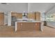 Well-lit kitchen with stainless steel appliances, a center island with seating, and ample cabinet space for storage at 2749 Horseshoe Dr, Las Vegas, NV 89120