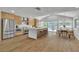 Stunning kitchen featuring stainless steel appliances, a large center island, modern light fixtures, and an adjacent dining area at 2749 Horseshoe Dr, Las Vegas, NV 89120