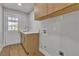 Practical laundry room with a sink, countertop, and storage, adjacent to an exterior door at 2749 Horseshoe Dr, Las Vegas, NV 89120