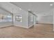 Spacious living room with beamed ceiling, recessed lighting, wood-look flooring, and backyard views from several windows at 2749 Horseshoe Dr, Las Vegas, NV 89120