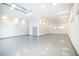 Large garage with bright lighting, epoxy floor, and ample space at 3030 S Formula Ct, Pahrump, NV 89048