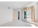 Bright bedroom with sliding glass doors, a closet and neutral carpet at 322 Karen Ave # 808, Las Vegas, NV 89109