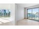 Bright living room featuring floor-to-ceiling windows with city views and tile flooring at 322 Karen Ave # 808, Las Vegas, NV 89109