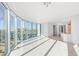 Bright living room featuring floor-to-ceiling windows with city views and tile flooring at 322 Karen Ave # 808, Las Vegas, NV 89109