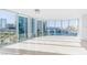 Bright living room featuring floor-to-ceiling windows with city views and tile flooring at 322 Karen Ave # 808, Las Vegas, NV 89109