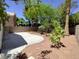 Expansive backyard features drought-tolerant landscaping and a concrete patio at 326 Lander Dr, Henderson, NV 89074