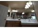 Bathroom with a white countertop, decorative light fixture, and mirror at 326 Lander Dr, Henderson, NV 89074