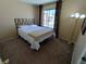 Comfortable bedroom with a large window and stylish curtains at 326 Lander Dr, Henderson, NV 89074