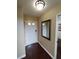 Entryway featuring a front door, hardwood floors, a mirror, and neutral wall colors at 326 Lander Dr, Henderson, NV 89074