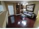 Cozy living room with a comfortable gray sofa, stylish lighting, and beautiful dark wood flooring at 326 Lander Dr, Henderson, NV 89074