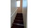 Staircase with hardwood steps and a handrail at 326 Lander Dr, Henderson, NV 89074