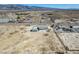 Distant aerial view of a home and garage with mountains in the background at 3420 Malibou Ave, Pahrump, NV 89048