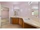 Bathroom featuring a double vanity with wood cabinets and tile flooring at 3420 Malibou Ave, Pahrump, NV 89048