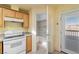 This kitchen offers a bright pantry with shelving and direct access to a deck, enhancing convenience at 3420 Malibou Ave, Pahrump, NV 89048