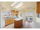 Bright kitchen featuring an island, modern appliances, and double French doors to a cozy balcony at 3420 Malibou Ave, Pahrump, NV 89048