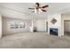 Spacious living room featuring a cozy fireplace and bright windows, perfect for relaxing at 3420 Malibou Ave, Pahrump, NV 89048