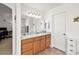 Well-lit bathroom with vanity, mirror, and walk-in shower at 3430 Flagstone Ct # 2, Pahrump, NV 89048