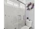 Bright bathroom with a glass-enclosed shower featuring white subway tile and marble accents, next to the toilet at 3430 Flagstone Ct # 2, Pahrump, NV 89048