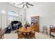 Bright dining room with vaulted ceilings and a desert view from large windows at 3430 Flagstone Ct # 2, Pahrump, NV 89048