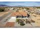 Front view of a cozy home in a desert community, surrounded by arid landscape and distant mountains at 3430 Flagstone Ct # 2, Pahrump, NV 89048