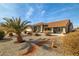 Lovely single-story home featuring a low-maintenance xeriscape front yard with gravel and a terracotta tile roof at 3430 Flagstone Ct # 2, Pahrump, NV 89048