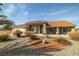 Charming single-story home featuring a low-maintenance xeriscape front yard and a terracotta tile roof at 3430 Flagstone Ct # 2, Pahrump, NV 89048