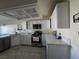 Modern kitchen featuring sleek countertops, stainless steel appliances, and bright white cabinets at 3550 Leor Ct, Las Vegas, NV 89121