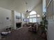 Inviting living room featuring a cozy fireplace, plush seating, and a large window at 3550 Leor Ct, Las Vegas, NV 89121