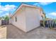 View of the home's exterior wall and desert-style yard with cacti, and a block wall at 3936 Savoy Ct, Las Vegas, NV 89115