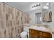 Bathroom featuring a single sink vanity, toilet, shower with curtain, large mirror and modern lighting at 3936 Savoy Ct, Las Vegas, NV 89115